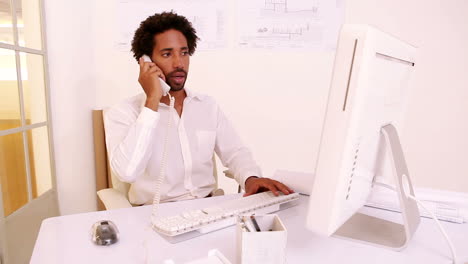 Businessman-working-at-his-desk