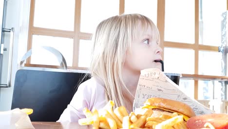 blonde-girl-at-fast-food-restaurant-sipping-on-soft-drink-soda-lemonade,-slowmo