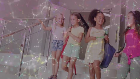 animation of networks over happy diverse schoolgirls talking on stairs