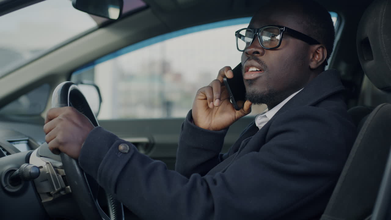 Man Driving and Talking on Phone