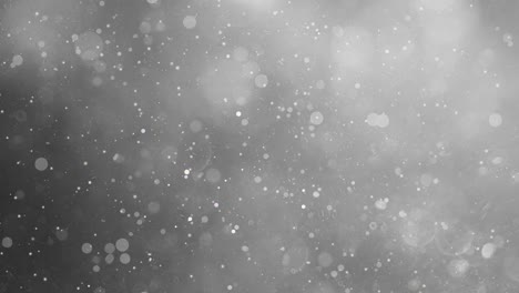 abstract background - ethereal motion: mesmerizing gray particles - grey bokeh lights in motion