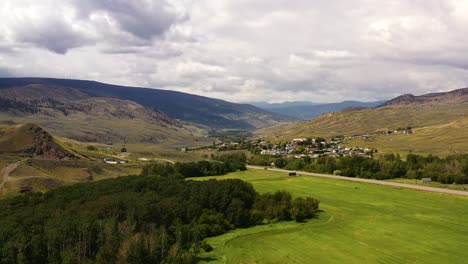 contrast of cultivation: stunning aerial footage of lush farm fields bordering the sparse, sagebrush-covered landscape of cache creek