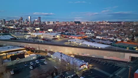 panormaic aerial overivew at dusk with glow of lights in denver's industrial district