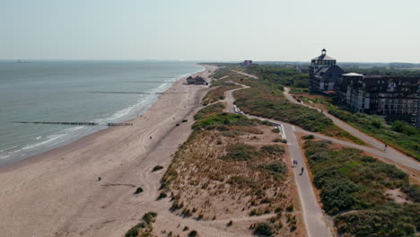 Flying-Over-Strand-Cadzand-Bad-In-Boulevard-de-Wielingen,-Cadzand,-Netherlands