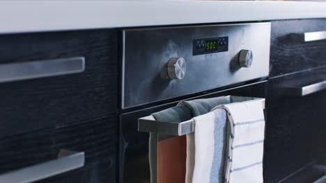 modern kitchen oven with towels