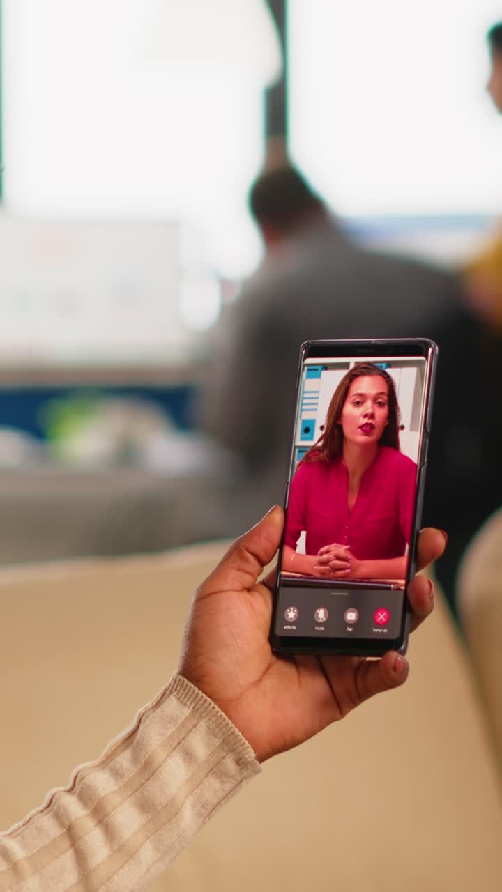 Vertical video Back view of african woman discussing with remote manager on video call
