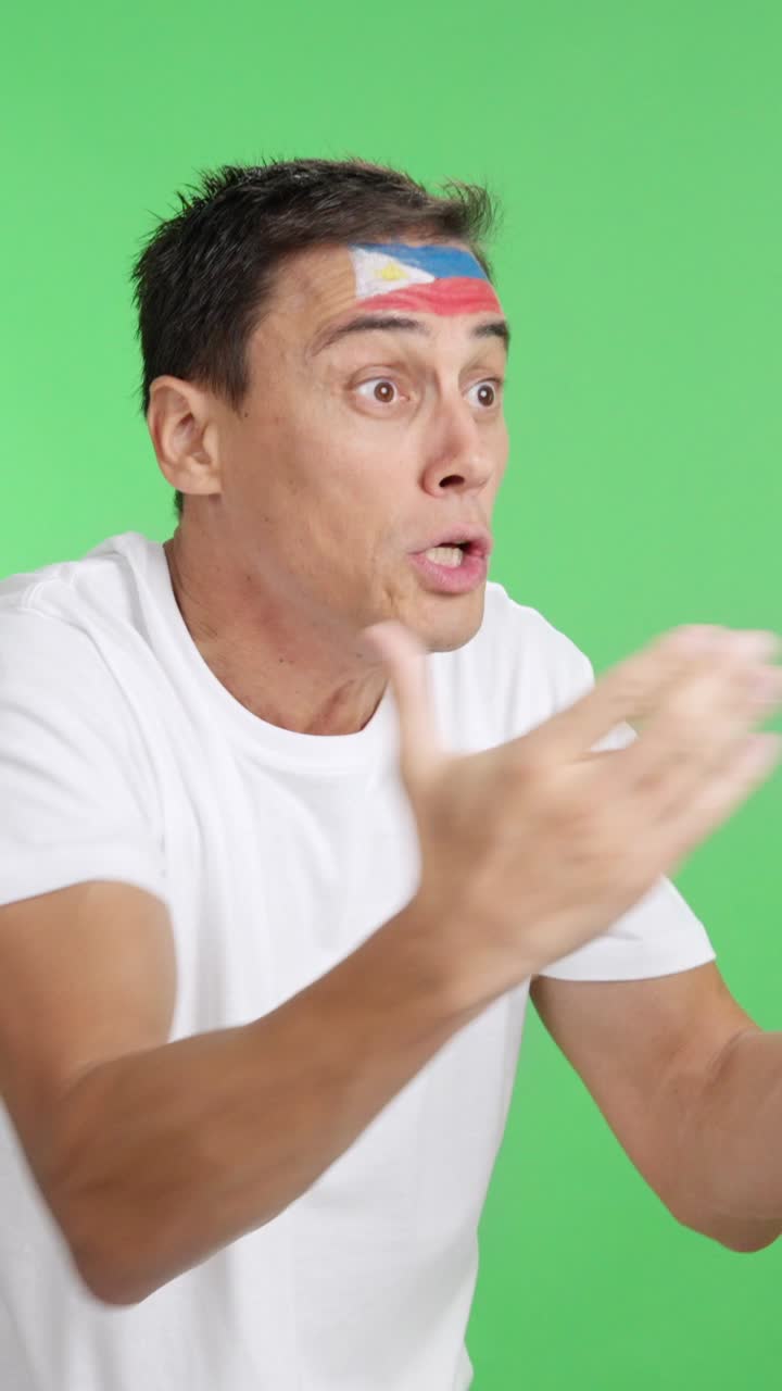 Man cheering for Philippines, angry with the decision of referee