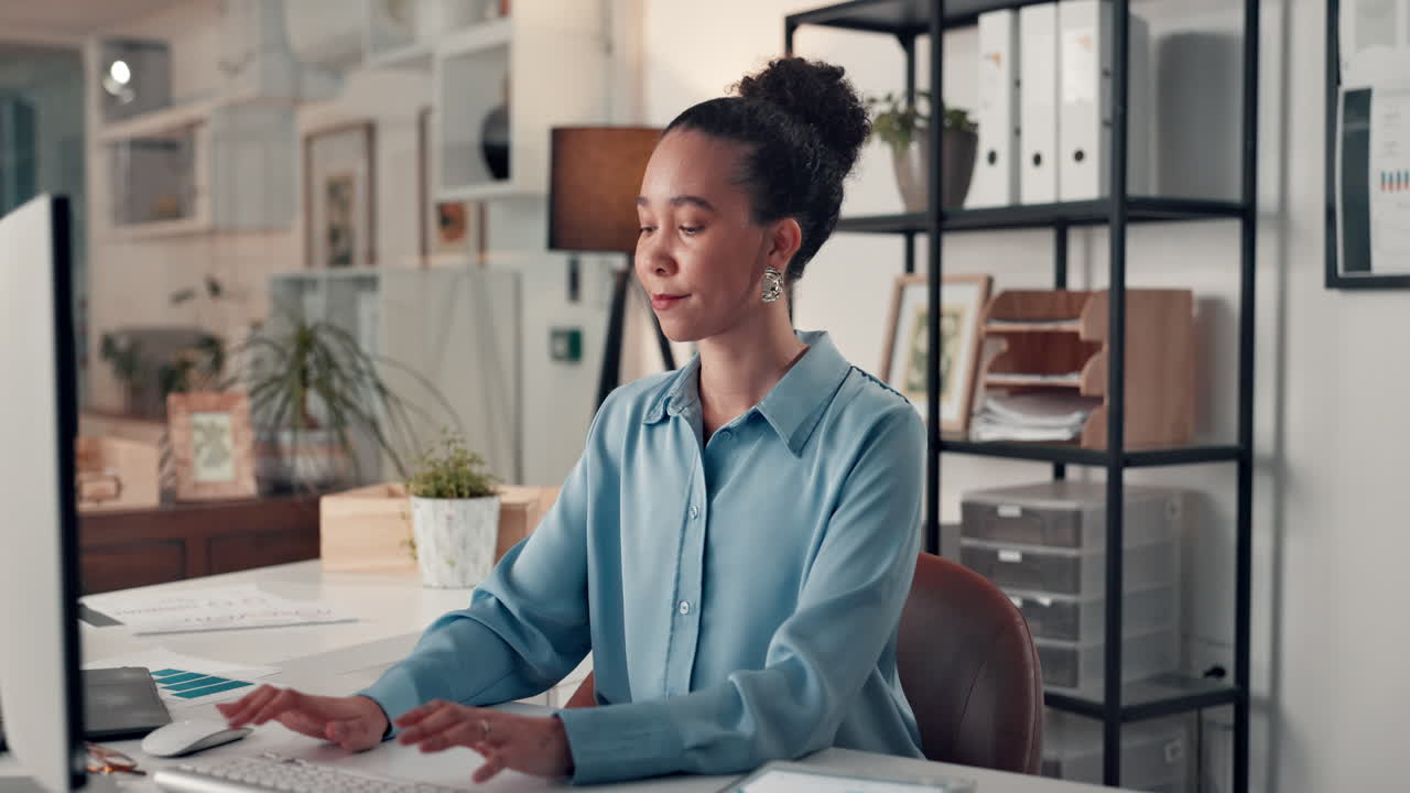 Woman sitting at desk in modern office