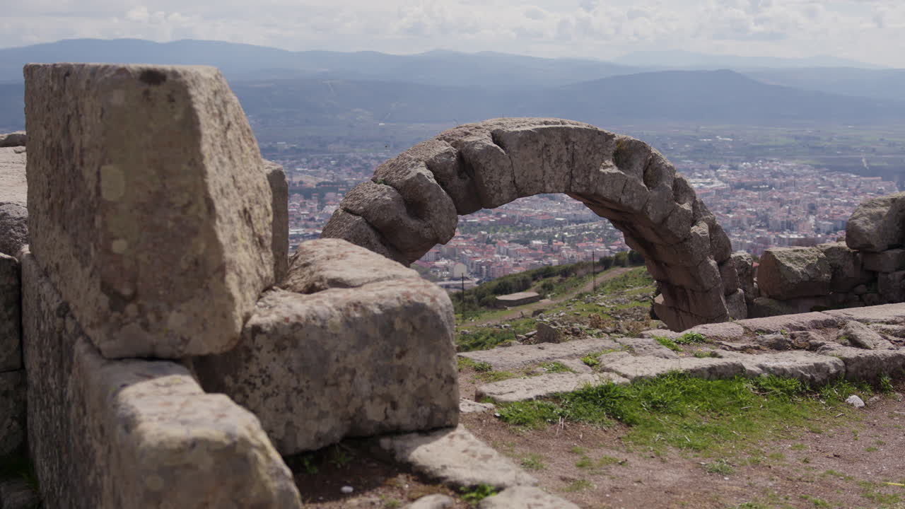 Stone arch overlooking a city in Pergamum