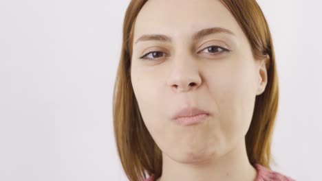 close-up of woman eating wafer. eating chocolate.