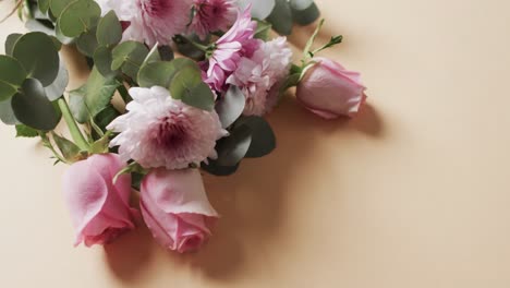 Video-of-bunch-of-white-and-pink-flowers-and-copy-space-on-yellow-background