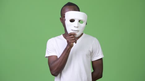 young african man with white mask