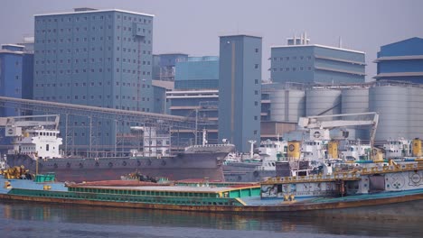 industrial harbor with cargo ships and factories