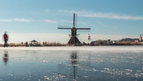 ice skaters on frozen canal in netherlands winter, time lapse