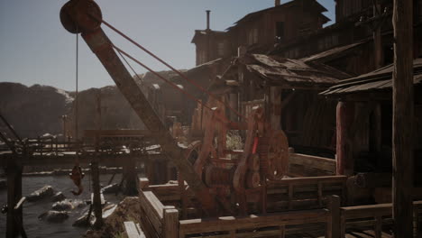 rustic wooden crane at a coastal fishing village during bright daylight