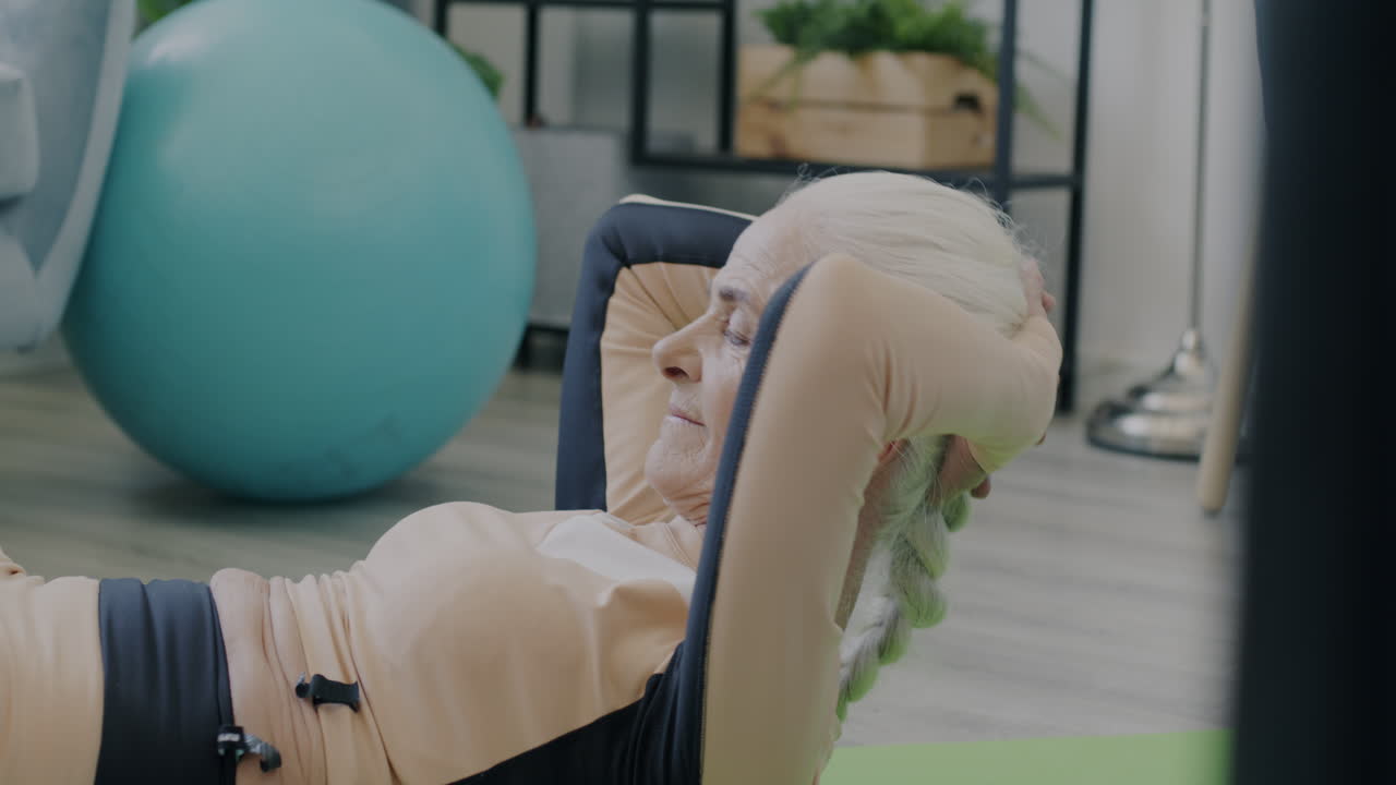 Senior Woman Doing Sit-Ups at Home