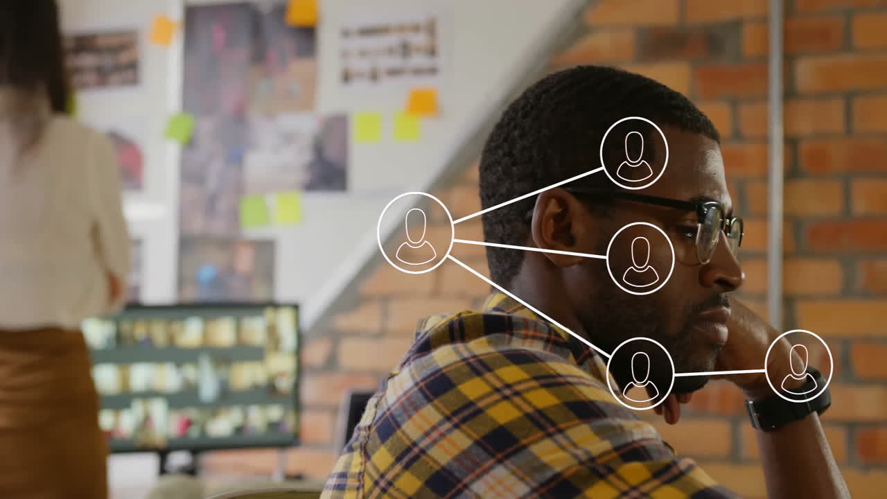 In office, man working with animation of network connection icons overlaying