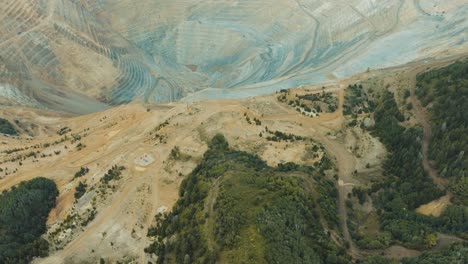 bingham or kennecott copper mine in utah, aerial tilt up to reveal the slat lake valley