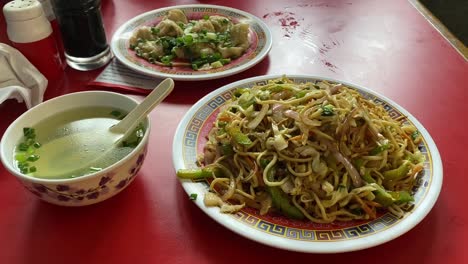 Close-up-shot-of-tasty-Tibetan-dishes-on-a-table-inside-a-restaurant-in-Kolkata,-India