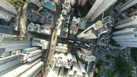 Downtown-Hong-Kong-city-skyscrapers-and-urban-traffic,-Aerial-view