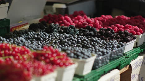 assorted fresh berries at a market stall