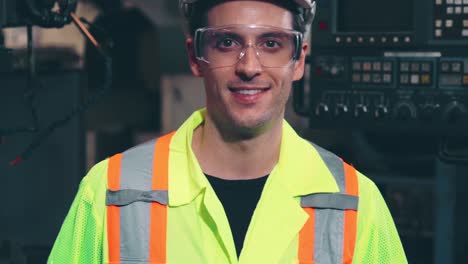 young factory worker or engineer close up portrait in factory