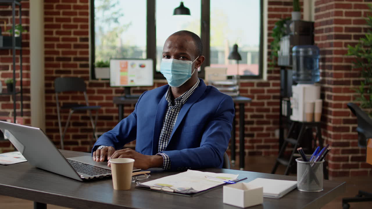Portrait of company employee working on business project