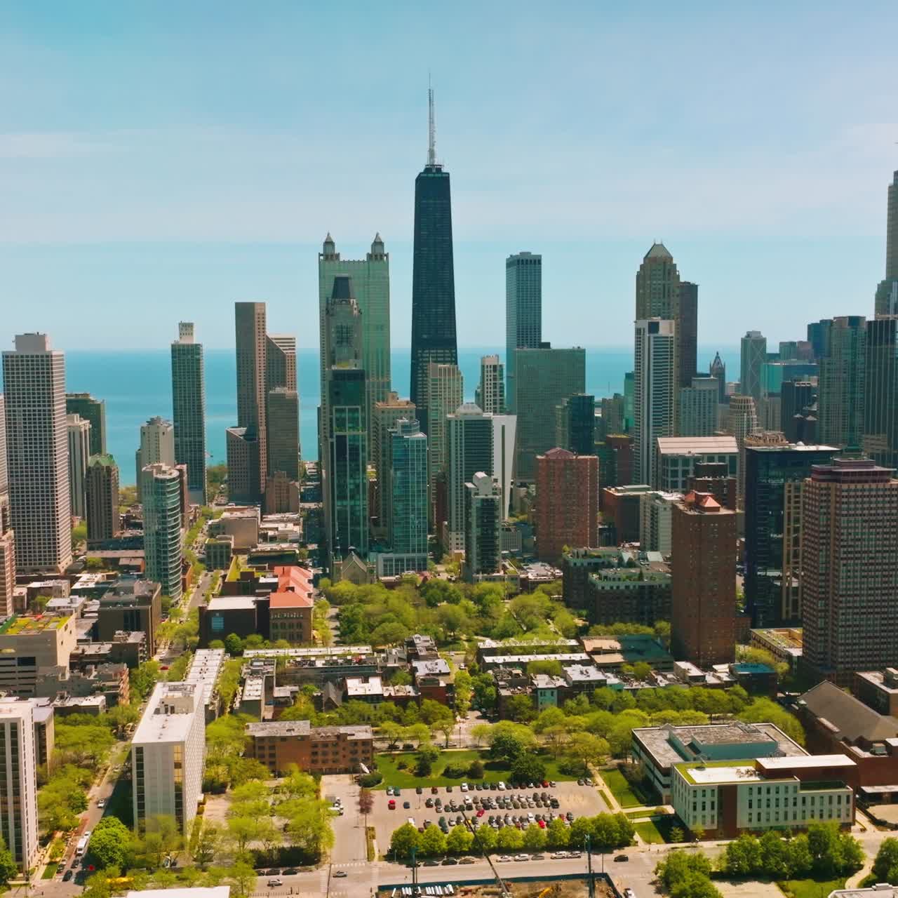 Expensive residential area with skyscrapers in Chicago. Sunny day footage in the urban city against scenic Michigan Lake
