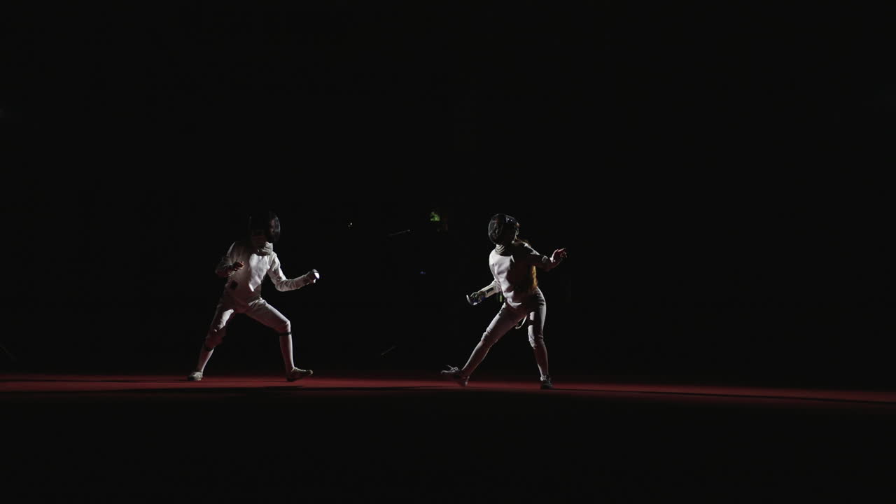 Two fencers in a competition