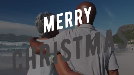 Animation-of-christmas-greetings-text-over-senior-biracial-couple-on-beach