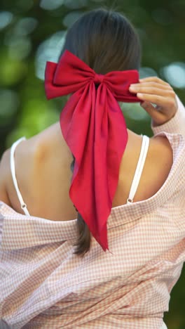 woman with red bow in her hair