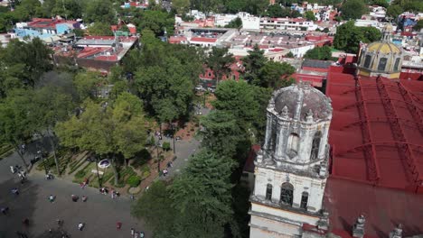 Above-coyoacan,-aerial-tour-of-historic-church-San-Juan-Bautista-at-Mexico-City