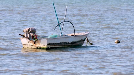 a man tends to tasks on a small boat