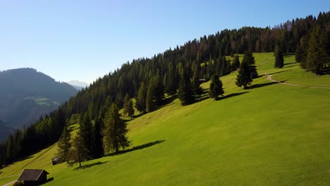 drone landscape of small settlement on green hill