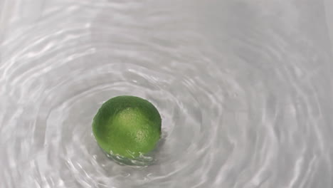 lime turning in water in super slow motion