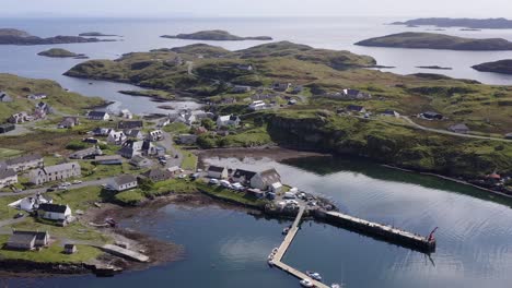 Drone-shot-circumnavigating-the-Isle-of-Scalpay,-an-island-near-the-Isles-of-Harris-and-Lewis-on-the-Outer-Hebrides-of-Scotland