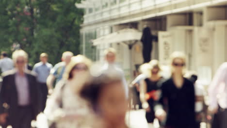 anonymous crowd of business people walking in city streets london summer 2014