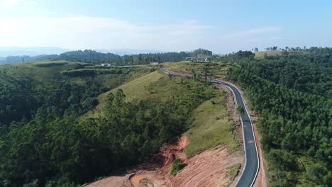 Beautiful-plane-with-drone-filming-a-narrow-road-that-leads-to-a-large-old-plane-transformed-into-cinema,-magic,-sublime,-history,-in-4K-resolution