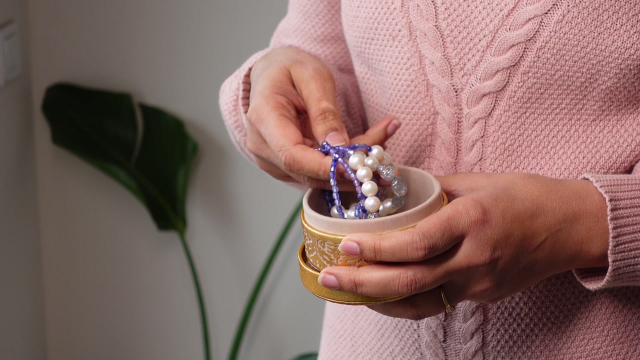 Woman's Hands Opening and Closing a Decorative Jewelry Box with Bracelets