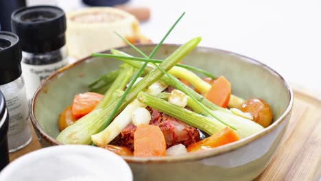 close-up shot of a french stew decorated with a selection of vegetables