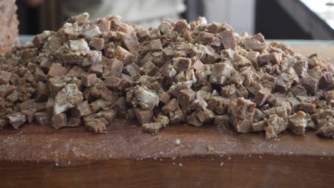 pile of chopped fudge or confectionery on a wooden surface