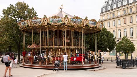 people enjoying a carousel in bordeaux