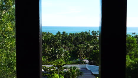exotic landscape seen though window with metal bars in prison cell