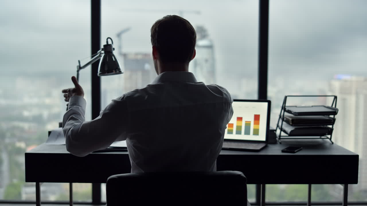 Unrecognizable businessman looking at bad finances