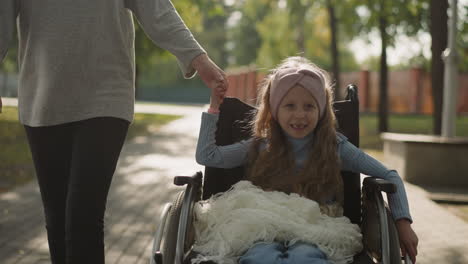 Toothless-girl-smiles-rotating-wheel-of-medical-equipment