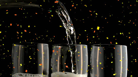 animation of confetti falling over champagne pouring into three glasses on black background