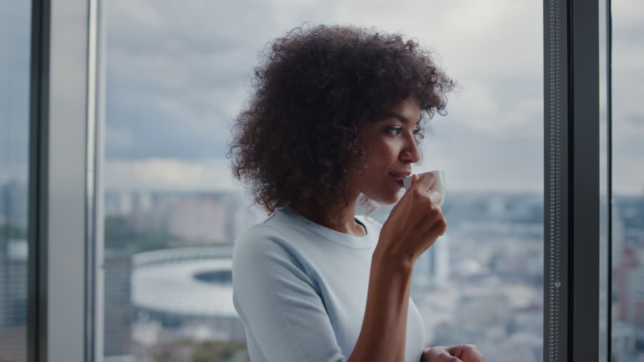Portrait of African american businesswoman drinking coffee