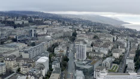 Drone-Aerial-of-the-beautiful-swiss-city-center-of-lausanne-located-on-the-lake-geneva-in-Switzerland-during-winter,-Europe