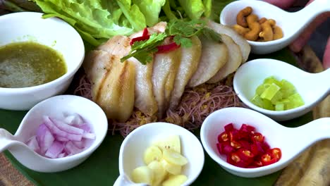 delicious grilled pork with various thai condiments