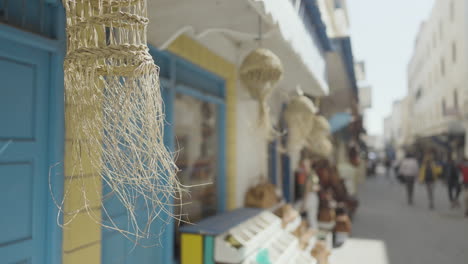 colorful mediterranean street with woven lamps